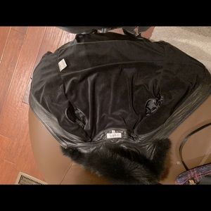 Women’s leather jacket with fox fur lined hood.